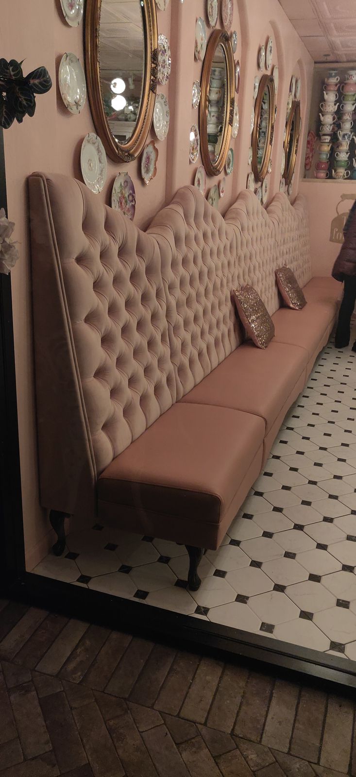Length view of custom button-tufted banquette, English Rose Tea Room